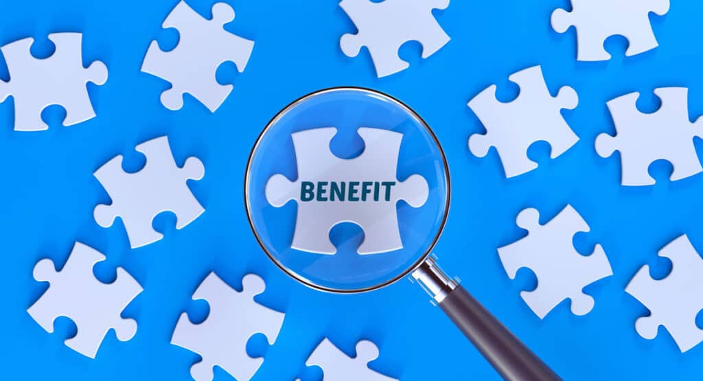 magnifying glass over a puzzle piece that says benefit