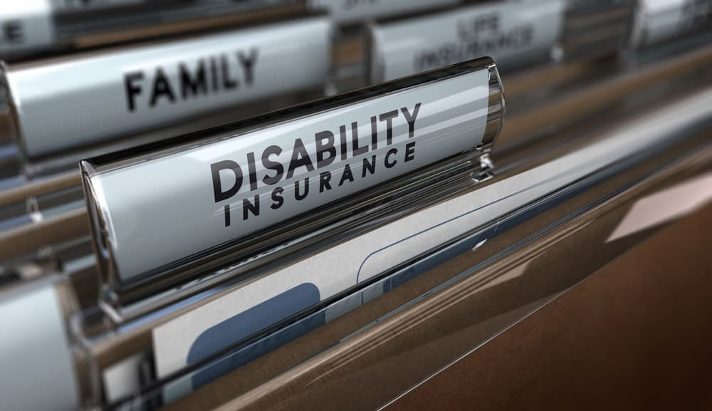 file folders with label of disability insurance in front and family behind