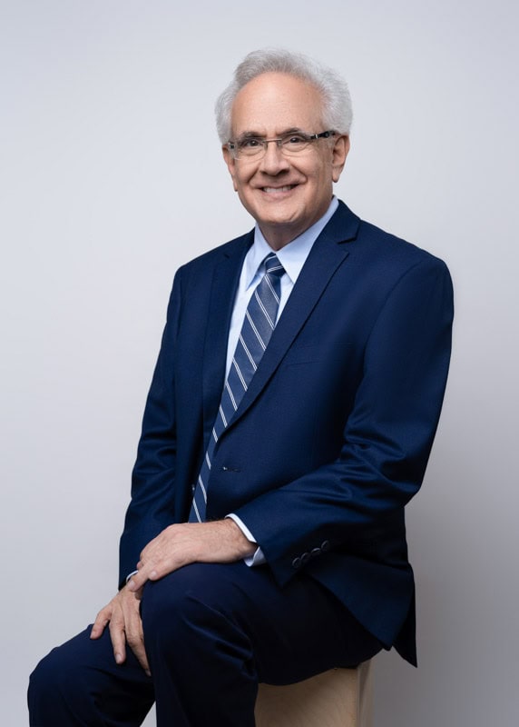 Headshot of Howard Silvermintz, insurance agent looking professional on solid color background